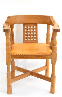 Lot 526 - A Robert  "Mouseman " Thompson Oak Monks Chair, with curved back and shaped arms, over three...