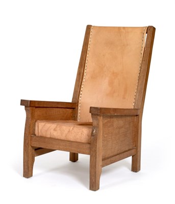 Lot 527 - A Robert  "Mouseman " Thompson Oak Smoking Chair, with slung leather back, solid seat with cow hide