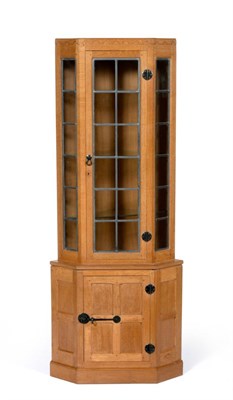 Lot 528 - A Robert  "Mouseman " Thompson Oak Corner Display Cabinet, penny moulded frieze, the upper...