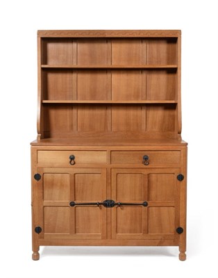 Lot 536 - A Robert  "Mouseman " Thompson 4'  Oak Welsh Dresser, the open delft rack with two fixed...