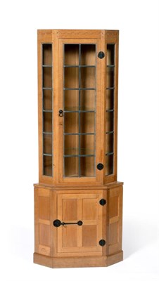 Lot 539 - A Robert  "Mouseman " Thompson Oak Corner Display Cupboard, penny moulded frieze, the upper section