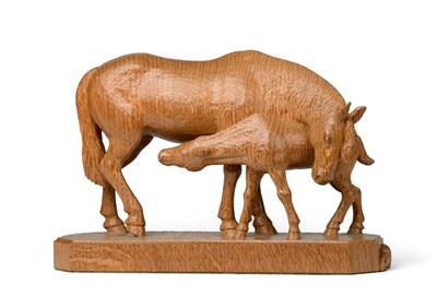 Lot 552 - A Robert  "Mouseman " Thompson Carved Oak Mare and Foal Group, modelled suckling, on a tooled...