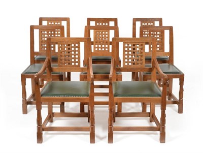 Lot 557 - A Set of Eight (6+2) Robert  "Mouseman " Thompson Oak High Lattice Back Dining Chairs, with...