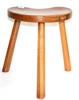 Lot 564 - A Robert  "Mouseman " Thompson Oak Cow Stool, on three legs, with carved mouse signature on...