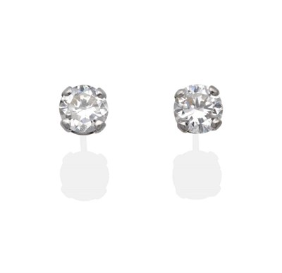 Lot 2001 - A Pair of 18 Carat White Gold Solitaire Diamond Earrings, round brilliant cut diamonds in claw...