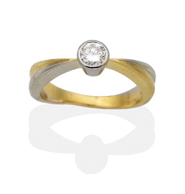 Lot 2028 - An 18 Carat Two Colour Gold Solitaire Diamond Ring, a round brilliant cut diamond in a rubbed...