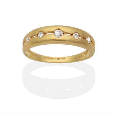 Lot 2045 - An 18 Carat Gold Diamond Half Hoop Ring, five graduated round brilliant cut diamonds channel set to