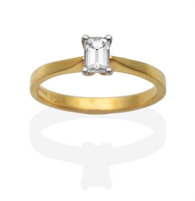 Lot 2054 - An 18 Carat Gold Octagonal Cut Solitaire Diamond Ring, in a claw setting, to knife edge...