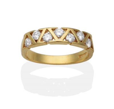 Lot 2055 - An 18 Carat Gold Diamond Half Hoop Ring, round brilliant cut diamonds in triangular tension...