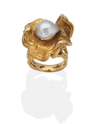 Lot 2060 - A Cultured Pearl Ring, a baroque pearl within a heavily textured undulating frame, to split...