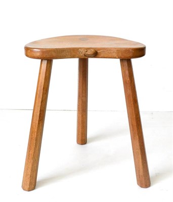 Lot 572 - A Robert  "Mouseman " Thompson Oak Cow Stool, 1984, on three octagonal legs, with carved mouse...