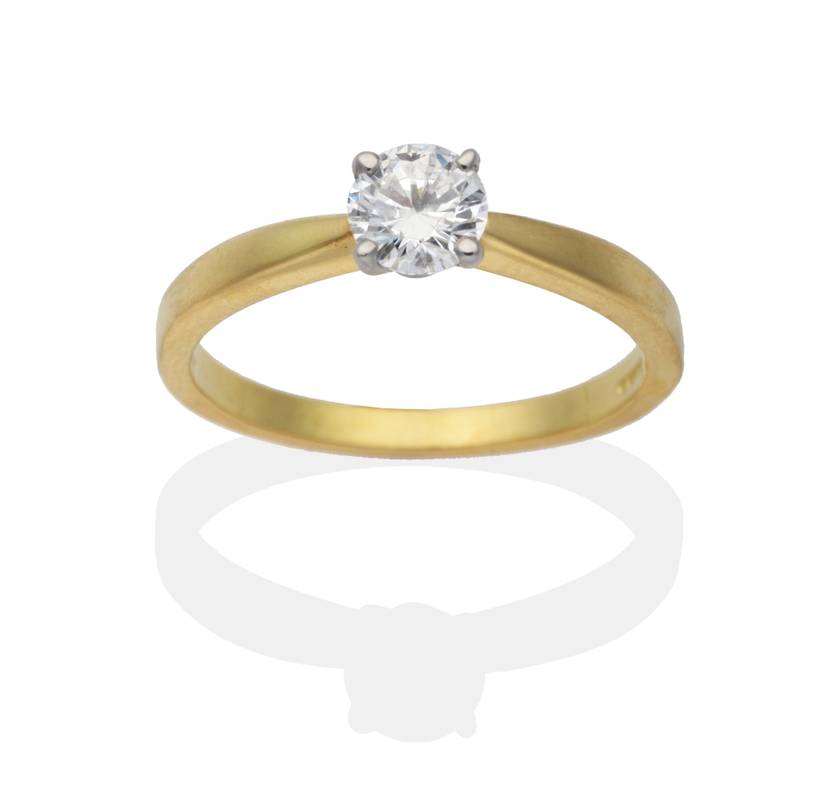 Lot 2066 - An 18 Carat Gold Solitaire Diamond Ring, a round brilliant cut diamond in a claw setting, to...
