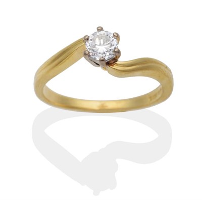 Lot 2075 - An 18 Carat Gold Solitaire Diamond Ring, a round brilliant cut diamond in a claw setting, to fluted