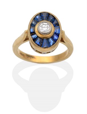 Lot 2076 - An 18 Carat Gold Sapphire and Diamond Cluster Ring, a round brilliant cut diamond in a rubbed...
