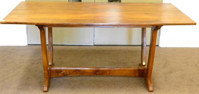 Lot 575 - An Alan Grainger Acorn Industries Walnut Dining Table, in the Cotswold tradition, on four chamfered