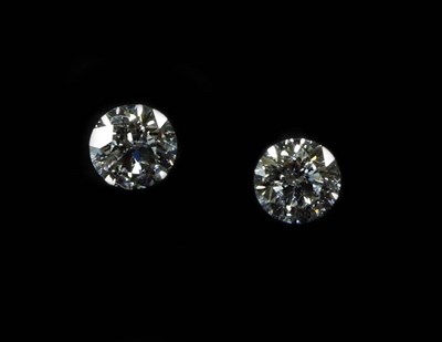 Lot 2106 - Two Loose Round Brilliant Cut Diamonds, each weighing 0.56 carat, Colour: F/G, Clarity: SI1