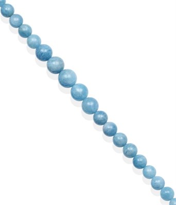 Lot 2107 - An Aquamarine Bead Necklace, graduated smooth aquamarine beads knotted to a magnetic ball...