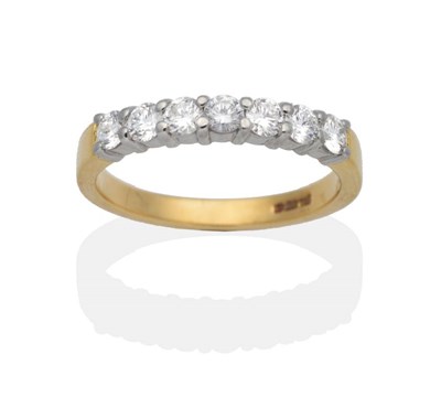 Lot 2112 - An 18 Carat Gold Diamond Half Hoop Ring, seven round brilliant cut diamonds in claw settings,...