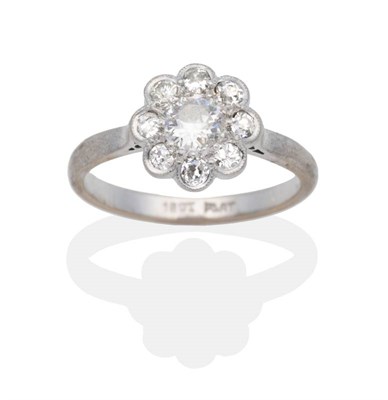 Lot 2118 - A Diamond Cluster Ring, an old cut diamond within a border of smaller old cut diamonds in...