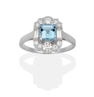 Lot 2119 - An Aquamarine and Diamond Ring, a square octagonal cut aquamarine in a claw setting, within a...