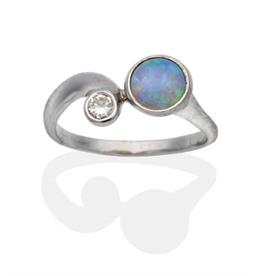 Lot 2123 - A 9 Carat White Gold Opal and Diamond Ring, a round cabochon opal and a round brilliant cut diamond