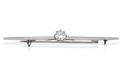 Lot 2134 - A Solitaire Diamond Bar Brooch, a round brilliant cut diamond in a claw setting, to a knife...