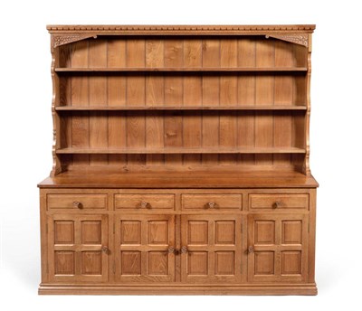 Lot 585 - A Colin  "Beaverman " Almack Oak 6ft Dresser, the rack with three plate shelves, the base...