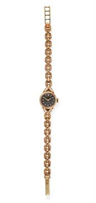 Lot 2174 - A Lady's 9ct Gold Wristwatch, signed Rolex, Precision, 1957, lever movement signed, black dial with