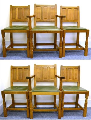 Lot 587 - A Set of Six (4+2) Colin  "Beaverman " Almack Oak Panel Back Dining Chairs, green upholstered...