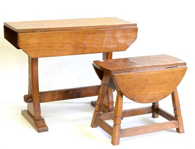 Lot 593 - A Kingpost Woodwork Occasional Drop Leaf Table, on two shaped supports, joined by a stretcher,...