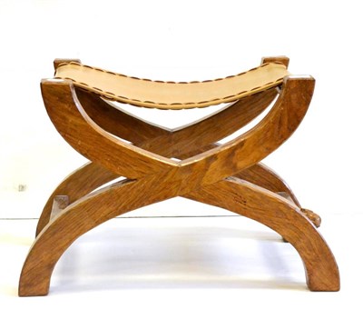 Lot 597 - A Peter  "Rabbitman " Heap Oak Cross-Frame Stool, leather seat, with carved rabbit signature,...