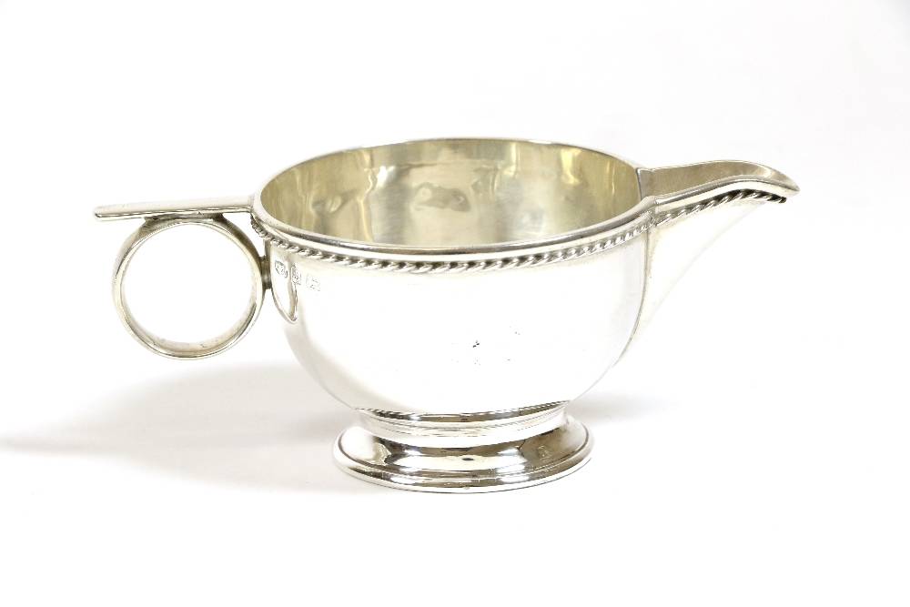 Lot 2279 - An Arts and Crafts Silver Cream Jug, A E Jones, Birmingham date indistinct, numbered 676 to...