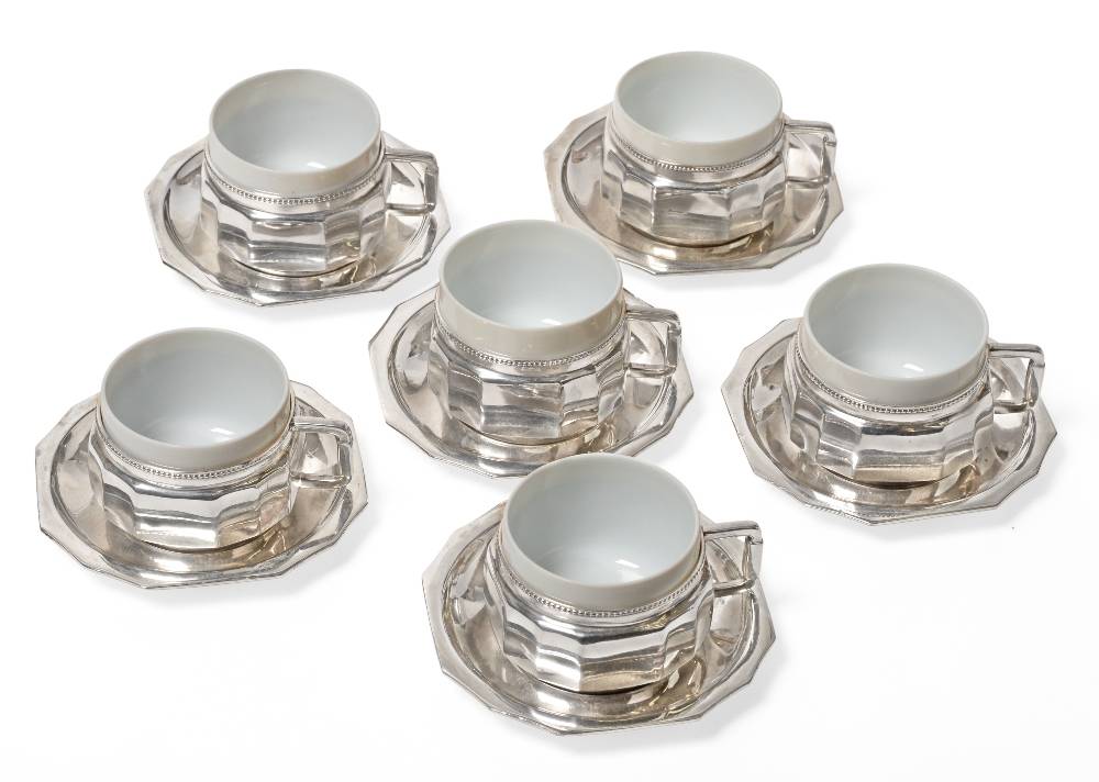 Lot 2317 - A Set of Six Austrian Silver Cups and Saucers, maker's mark K.B, Vienna, .800 standard, circa 1900