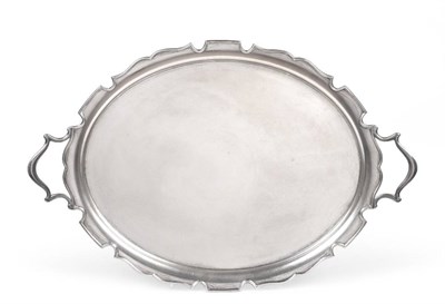 Lot 2344 - A Silver Twin Handled Tray, Edward Barnard & Sons, London 1927, oval with shaped rim, 48.5cm...