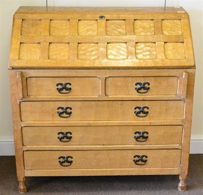 Lot 604 - A Sid Pollard Panelled Oak Bureau, fall front, fitted interior, plain lopers, over two short...