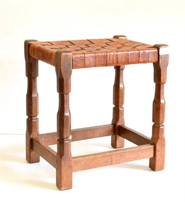 Lot 610 - A Sid Pollard of Thirsk Oak Stool, with leather lattice seat, on four octagonal legs joined by...