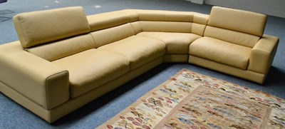 Lot 624 - A Modern Roche Bobois Cream Leather Corner Sofa, in three sections, labelled, 343.5cm long,...