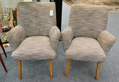 Lot 628 - A Pair of 1960s Easy Chairs, re-upholstered in a Farrow and Ball stripe fabric, on four...