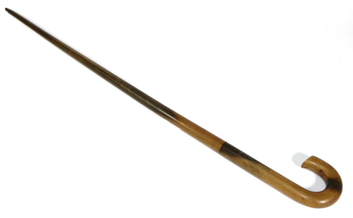 Lot 22 - A Rhinoceros Horn Walking Stick, circa 1900, with scroll handle, 87cm long