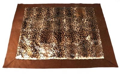 Lot 208 - Taxidermy: A Simulated Leopard Skin Carriage Rug, circa 1930, a patchwork carriage rug made from 28