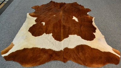 Lot 62 - Nguni Cow Hide (Bos taurus), modern, excellent quality AA grade brown and white cow hide floor rug