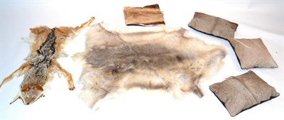 Lot 73 - Greenland Reindeer (Rangifer tarandus), skin rug; Three Kudu Skin Pillows; A Springbok Skin Pillow