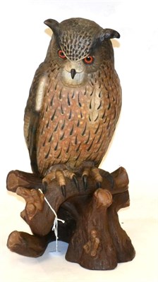 Lot 139 - An Austrian Painted Plaster Model of an European Eagle Owl, stood perched on a branch, 61cm high