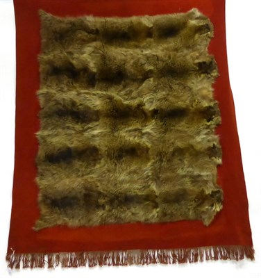 Lot 110 - An Animal Skin Mounted Red Wool Car Rug, probably circa 1930, composed of five pelts, possibly...