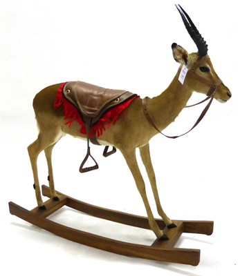 Lot 147 - Impala (Aepyceros melampus), full mount, on a hardwood rocking horse, saddled and with reins, 123cm