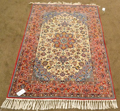 Lot 913 - Isfahan Rug Central Iran The cream field of palmettes and vines centred by a crimson and ice...