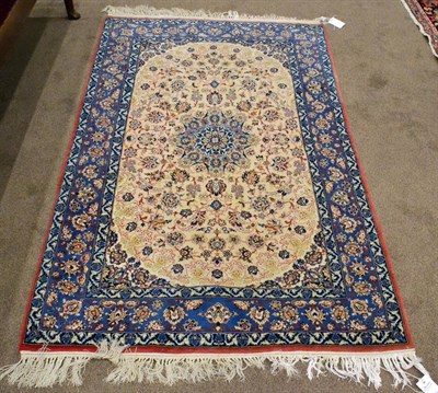 Lot 914 - Finely Woven Isfahan Rug Central Iran The ivory field cnetred by a mint green flowerhead...