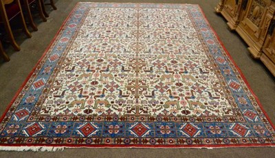 Lot 917 - Ghom Carpet Central Iran The ivory field with columns of geometric devices enclosed by pale...