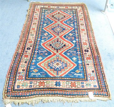 Lot 923 - Small Kazak Rug Central Caucasus The indigo field with a column of stepped and hooked...