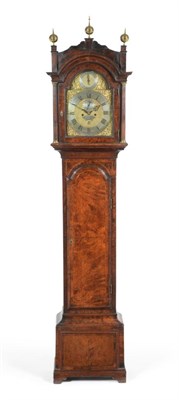 Lot 983 - A Walnut Eight Day Longcase Clock, arched pediment with brass ball finials, stop brass fluted...